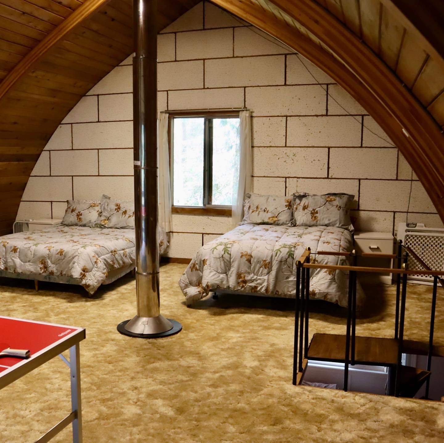 Before: two beds upstairs on shag carpet under the original arch