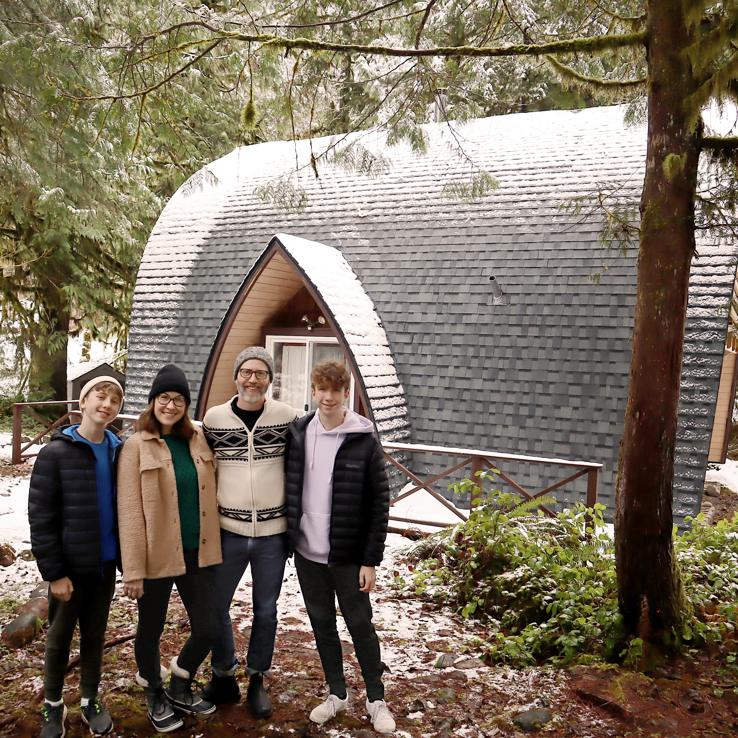 The Egner family in front of The Arch House in the snow, November 2021