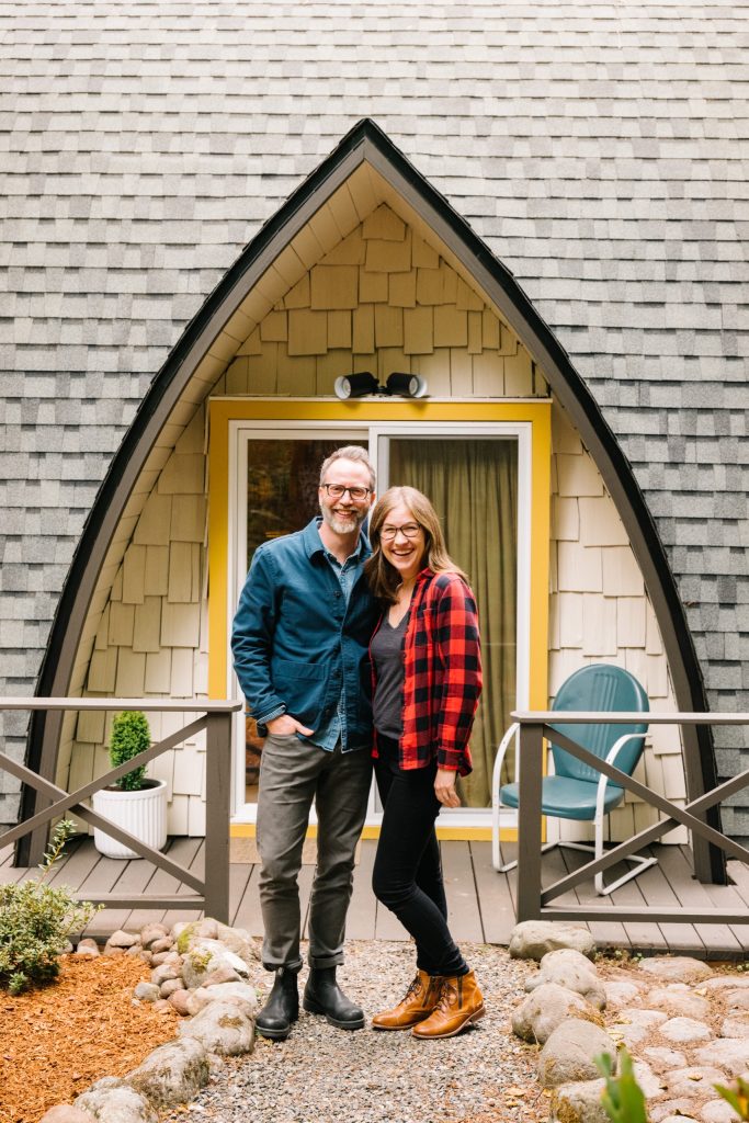 Erica and Alex standing in front of The Arch House