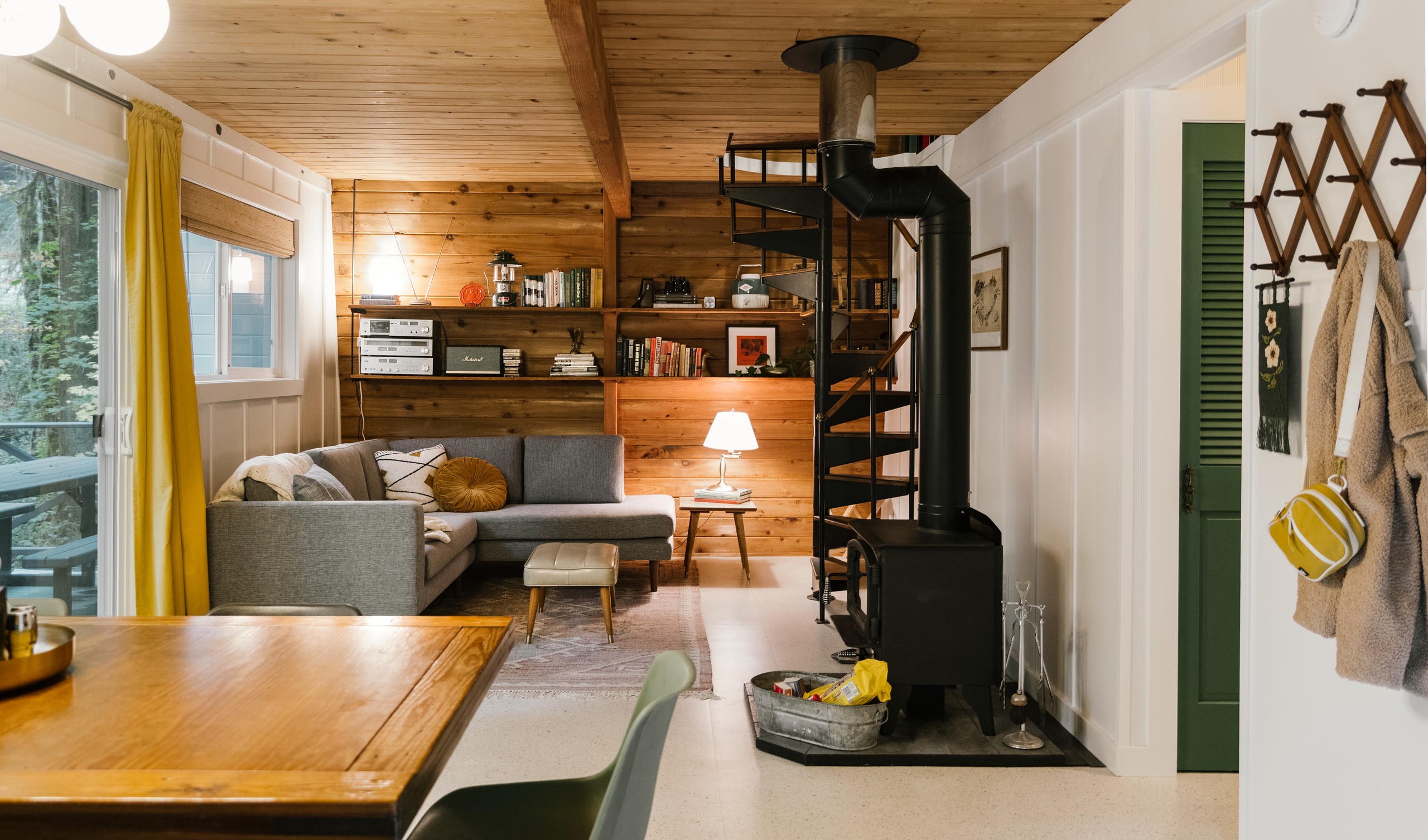 Living room and wood-burning stove viewed from the dining area